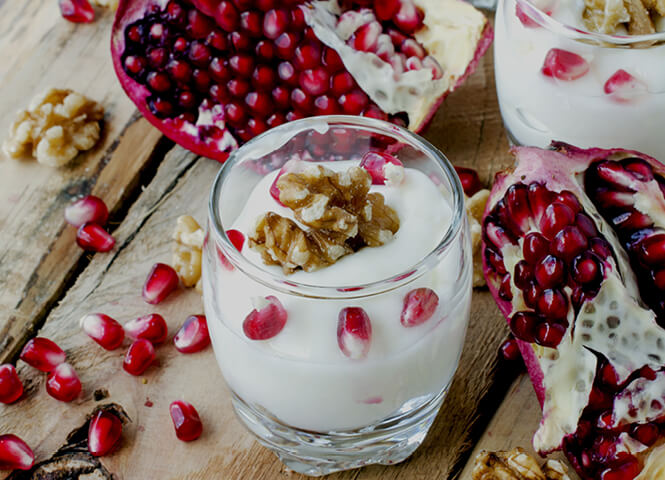 Yoghurt mousse with pomegranates and walnuts